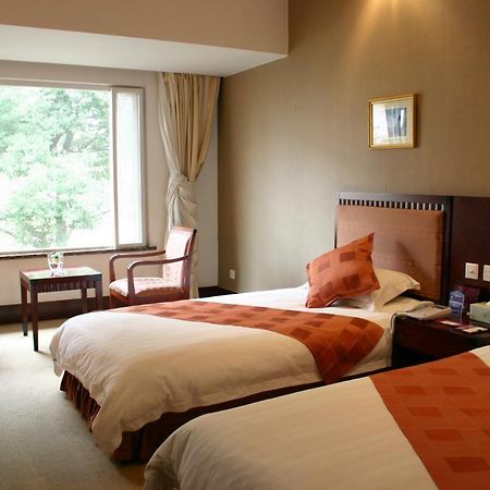 Suzhou Taoyuan International Holiday Hotel Стая снимка