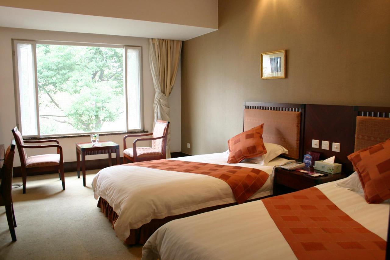 Suzhou Taoyuan International Holiday Hotel Стая снимка